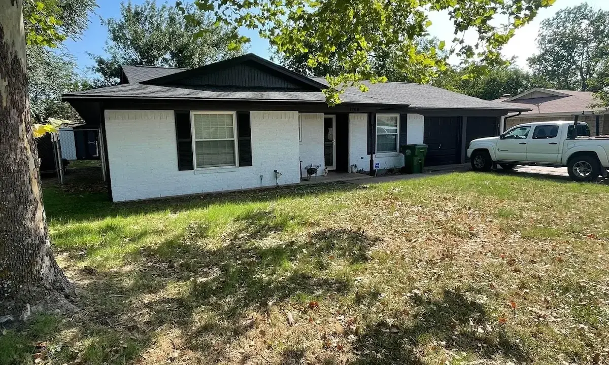 Professional roofing crew working on a residential roof in East Coventry